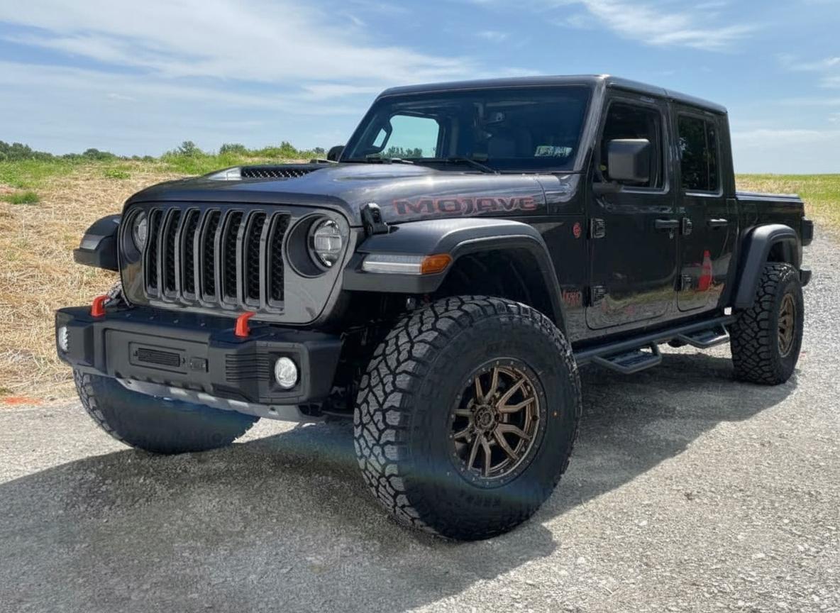 2022 Jeep Gladiator on 17x9 Fuel Rebel 5 - Bronze Black wheels with 320/70 tires, Stock suspension