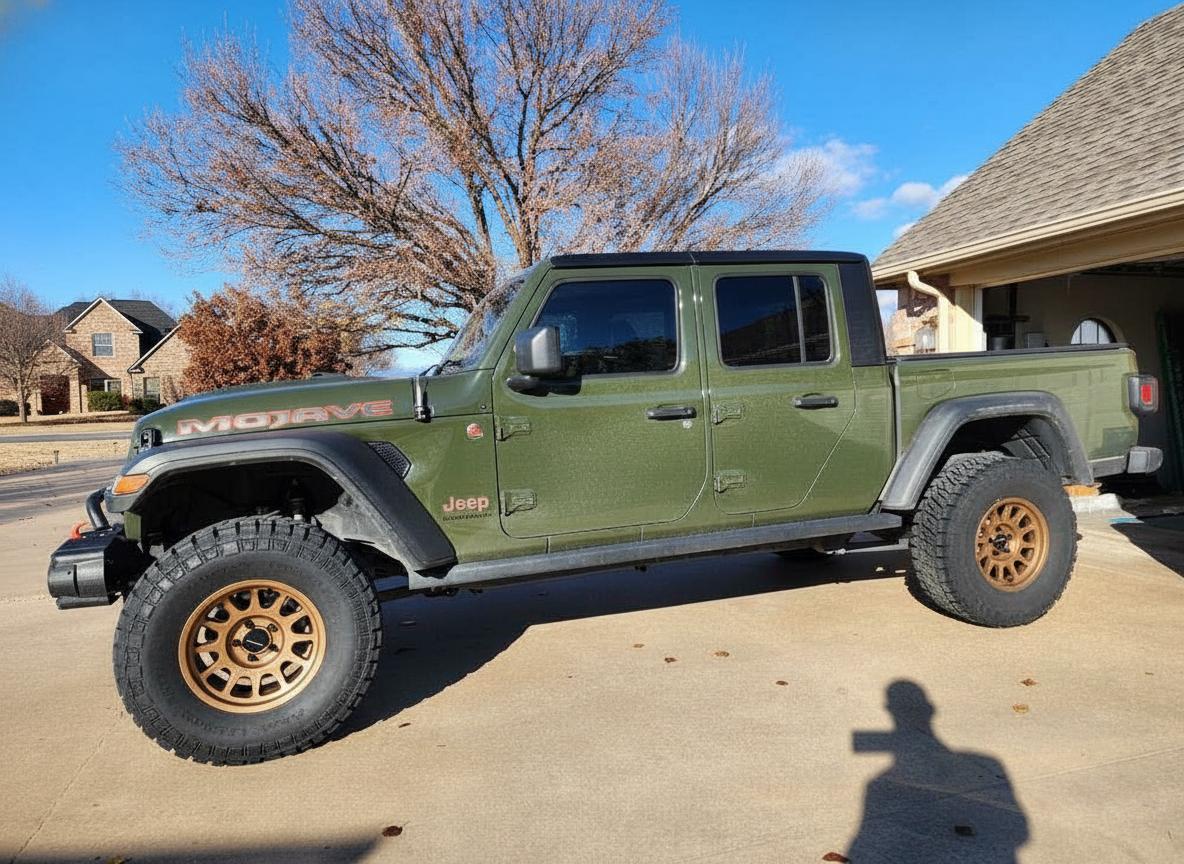 2022 Jeep Gladiator on 17x8.5 Method MR703 - Matte Bronze wheels with 320/65 tires, Rough Country leveling kit