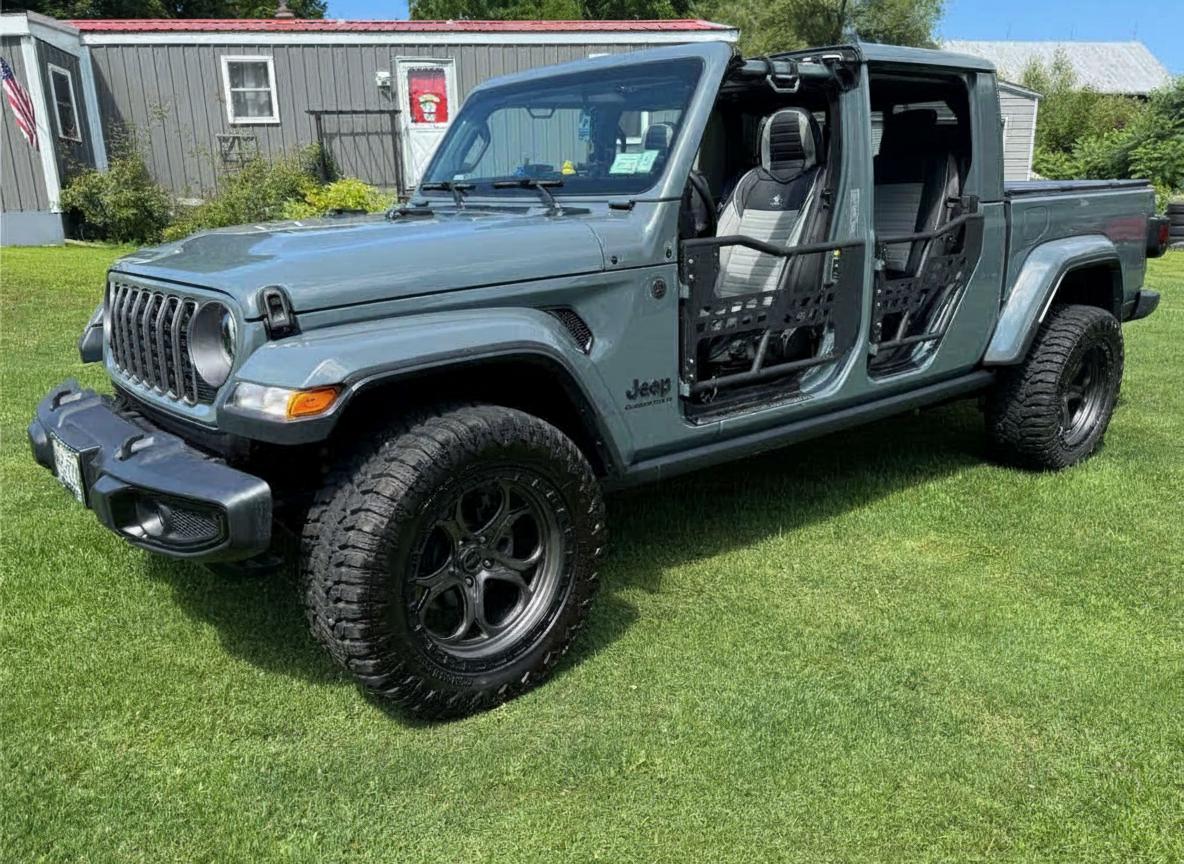 2025 Jeep Gladiator on 20x10 Weld-Off-Road Ledge - Satin Gunmetal Gray with a Black Simulated Beadlock wheels with 290/65 tires, Stock suspension
